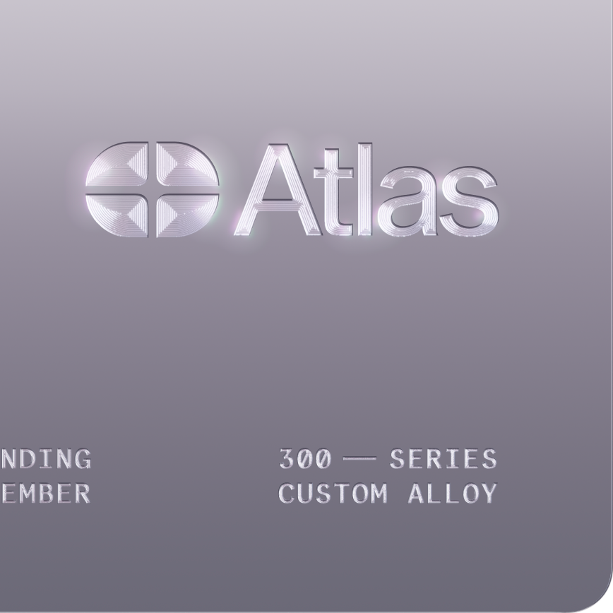 A close-up detailed image, highlighting the detailed engravings and mirror-like polished steel surface of an Atlas card.